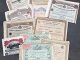 many different types of old paper money are on a table