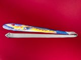 a pair of skis sitting on top of a red surface