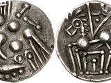 a close up of a silver coin with an image of a person on it