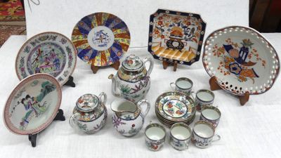many plates and cups and saucers on a table