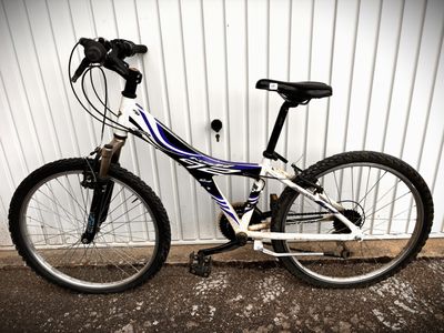 a bike that is parked in front of a building