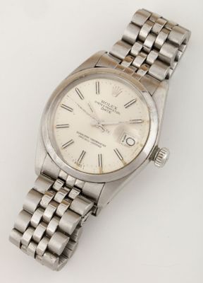 an image of a wrist watch with roman numerals on a bracelet