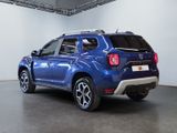 the rear end of a blue suv parked in a garage