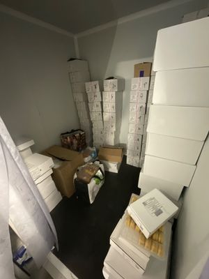 a room with a lot of boxes and boxes on the floor
