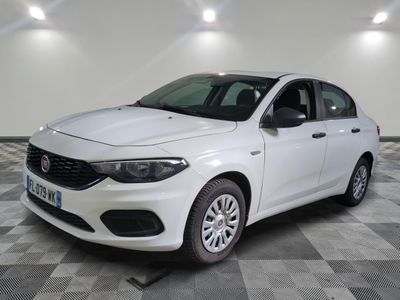 the white car is parked on a checkered floor in the garage
