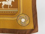 brown and tan silk scarf with a horse and rider on it