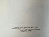 the back cover of a book with a black and white image of a cat