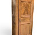 an image of a wooden cabinet with a door on top of it