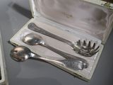 a silverware set in a case on a table