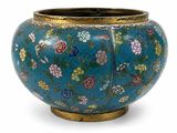 a blue vase with flowers on it on a white background