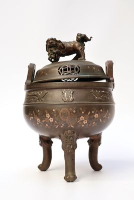 a large metal bowl with a horse on it