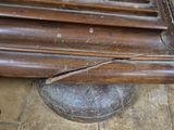 a picture of a wooden bench that has been damaged