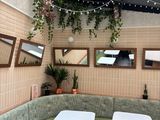 two tables and a bench in the corner of a restaurant