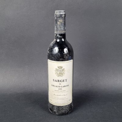 a bottle of wine that is sitting on a table