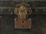 an old trunk with a lock on it