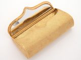 golden clutch bag with mirror on white background