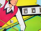 a close up of a pinball game with a man playing pool