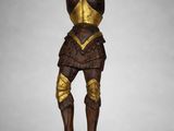 a wooden statue of a man in armor with a sword