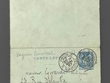 an old envelope with a stamp on it sitting on top of a table