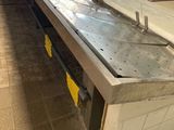an image of a long metal counter in a store
