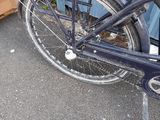 a bike that is parked in front of a building