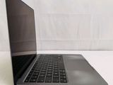 an open laptop computer sitting on top of a white table
