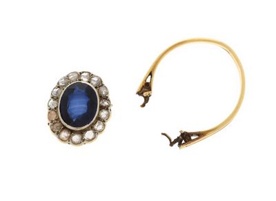a close up of a pair of earrings on a white background