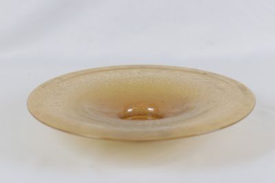 a glass bowl that is sitting on a white surface