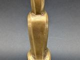 an image of a gold statue of a rabbit on a pedestal