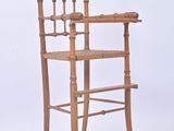 a wooden chair with a wooden seat on a white background