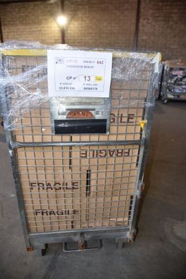 a cart that has some boxes on it in a warehouse