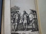 someone is holding a book with a drawing of a group of people on it