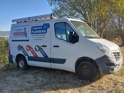 a white van that is parked in the grass