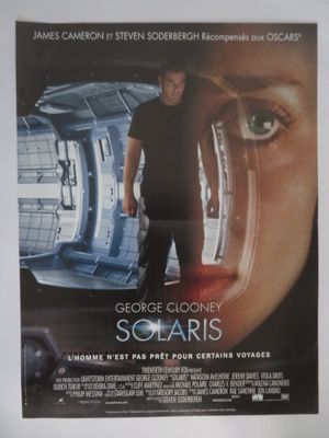 the poster for the movie solaris is hanging on the wall