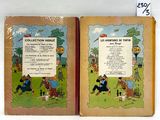 two books that are open on a white surface