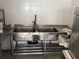an image of a kitchen with a sink and a refrigerator