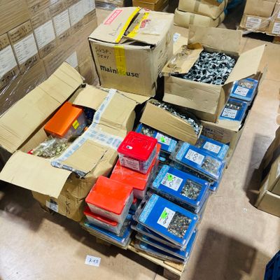 many boxes and boxes of assorted items on the floor