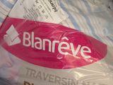 a bag of toilet paper that is wrapped in plastic