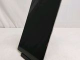 a black tablet computer sitting on top of a white table