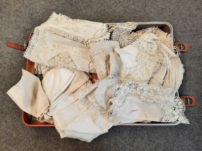 a suitcase full of lingerries on the floor