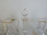 a group of glass vases that are sitting on a table