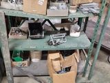 many boxes and boxes on a shelf in a garage