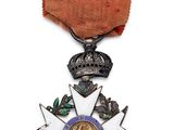 l'image d'une médaille surmontée d'une étoile