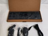 a box with a keyboard, mouse, and other items in it