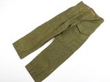 a close up of a pair of green pants on a white surface