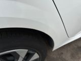 a close up of a car ' s tire with a sticker on it