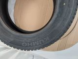 an image of a tire on a cardboard box on a white surface