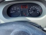 dashboard of a car with a steering wheel and dashboard gauges
