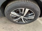 a close up of a tire on a car ' s rim