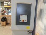 a machine that is sitting in a warehouse